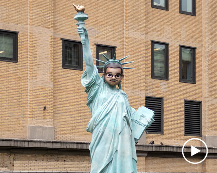 statue of liberty with emoji-inspired mask by paola pivi rises at the high line, NYC