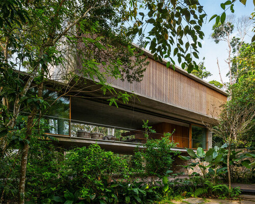 merging two stacked concrete boxes, ‘casa azul’ by studio MK27 fades into the brazilian flora