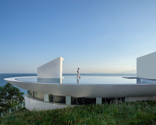 3andwich design's circular 'water drop' library opens toward expansive sea views in china