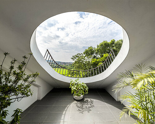 HCRA design completes split-level vietnamese home overlooking lush rice field