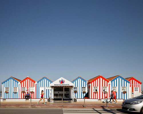 ferreira arquitectos mimics striped beach tents to restore a sailing club in portugal