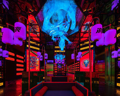 dragon sculpture and eclectic signage illuminate contemporary karaoke lounge in china