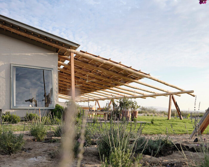 ghezzi novak shades idyllic retreat in pisco desert with sloping eucalyptus hardwood roof