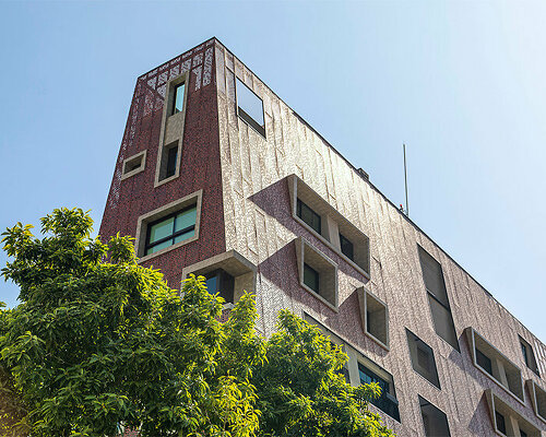 perforated red aluminum skin envelops gisele borges' pyramidal residential building in brazil