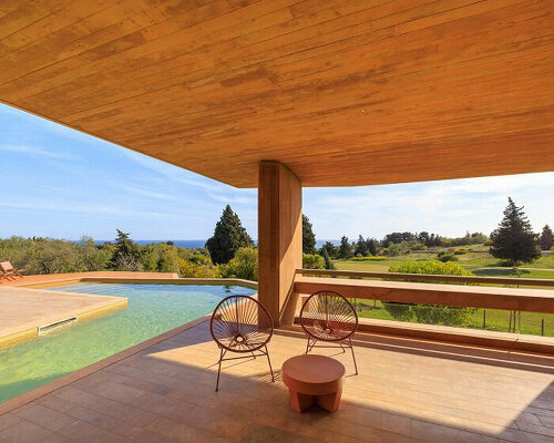 RCR arquitectes’ red concrete resort villa echoes the sandy hues and textures of the algarve