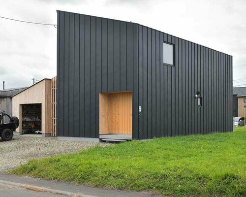 ryuji yamashita divides a building into two for its 'garage house' in hokkaido, japan