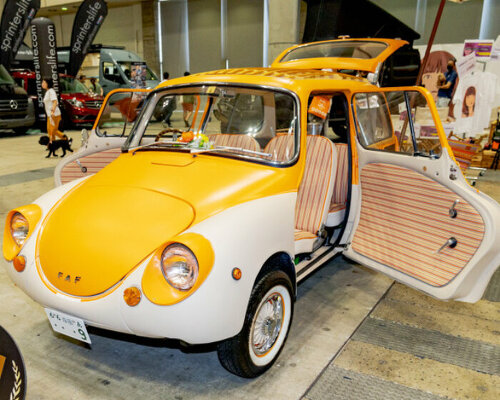 custom subaru 360 beach van oozes summer vibes with its orange hood and retro seats