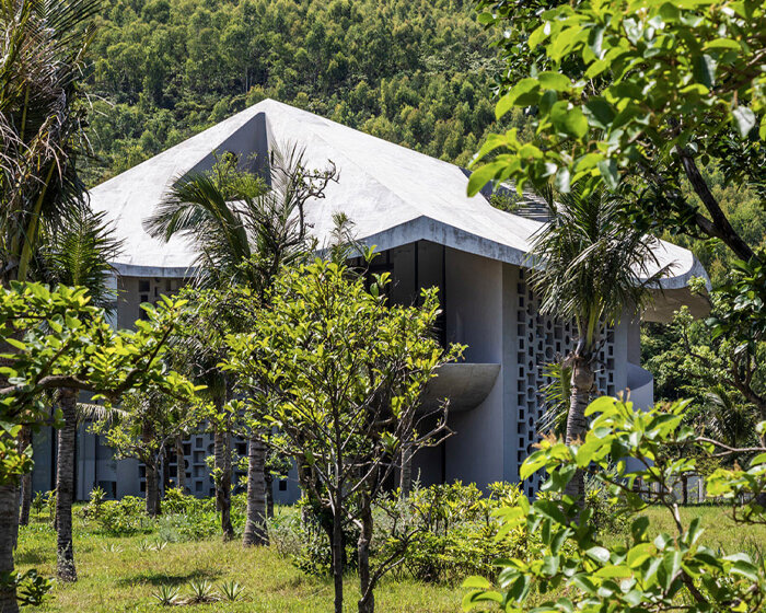 fitted with a conical roof, this living-working hub adapts to the harsh climate of vietnam