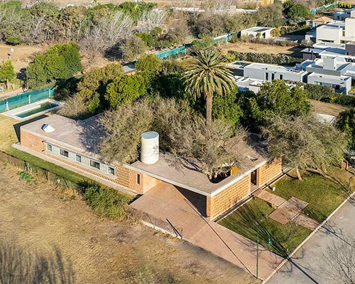 las marías house winds around profuse tree vegetation in cordoba city, argentina