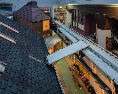 maki yoshimura builds nursery extension between two retaining walls in japan