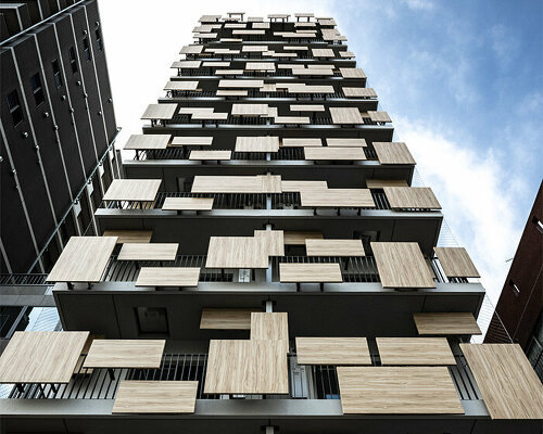 aluminum panels printed on wood pattern tetris-up the facade of kengo kuma's tokyo house