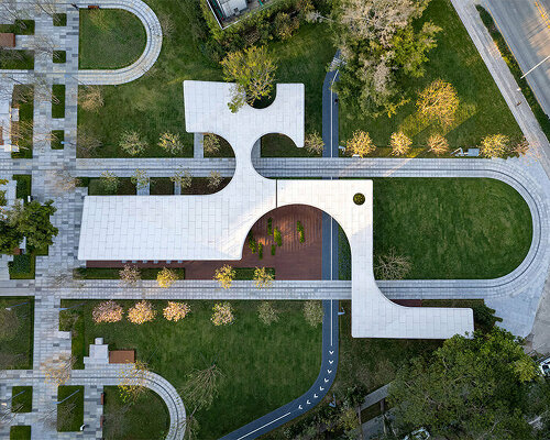 continuous cloud-shaped canopy tops atelier xi's tourist service center in shenzhen, china