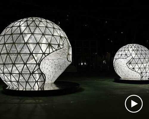 in celebration of the moon festival, spherical lanterns illuminate a soccer field in hong kong