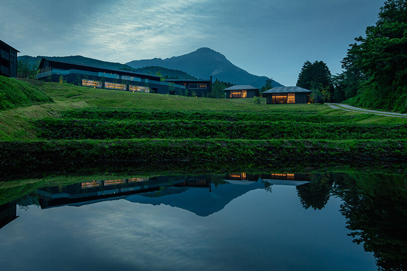 kengo kuma scatters hot spring hotel across sculpted rice terraces