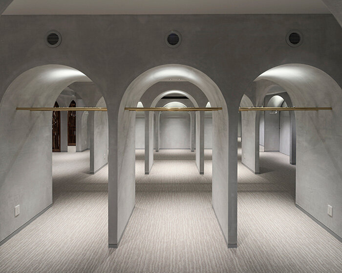 tsutsumi and associates forms labyrinth store in japan with romanesque concrete arches