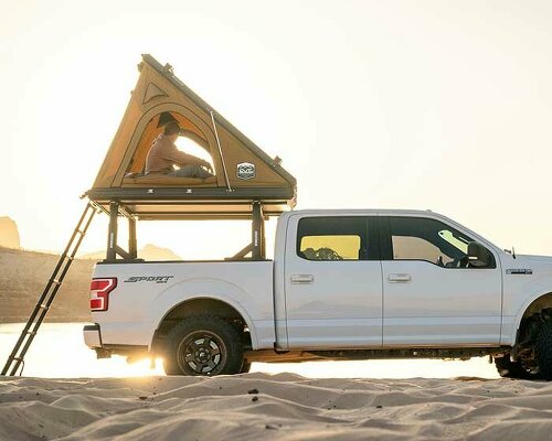 this lightweight pop-up tent creates a tiny sleek home on wheels