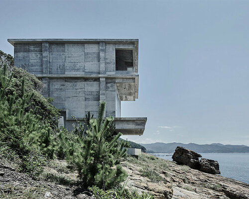 ninkipen! perches concrete seaside house on rugged national park landscape in japan