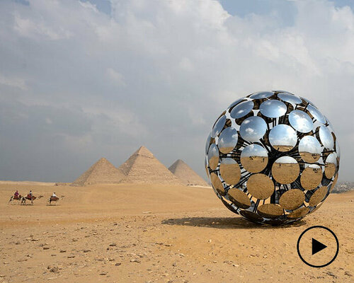 SpY’s chrome steel 'ORB' reflects giza pyramids and ancient egyptian symbology