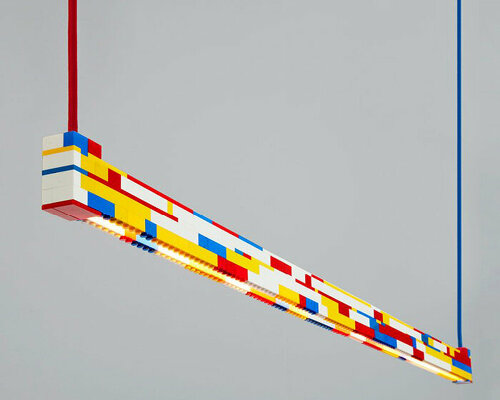 ambience studio’s repurposed LEGO light emanates a playful kaleidoscope of color