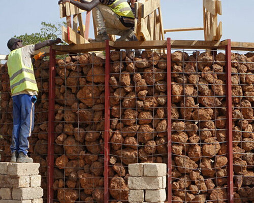 stone shed shelters concrete well facilitating free access to drinking water in senegal