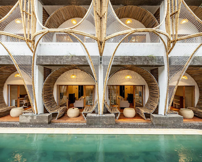 hotel renovation in bali celebrates bamboo with co-living space for digital nomads