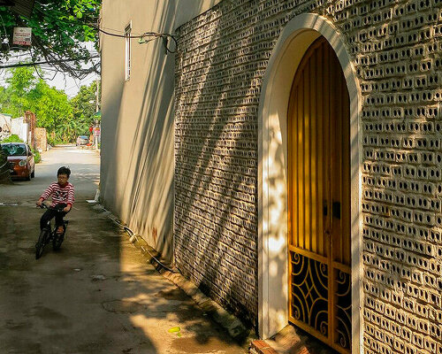 hole-brick wall maximizes airflow and daylight for tiny house in vietnam