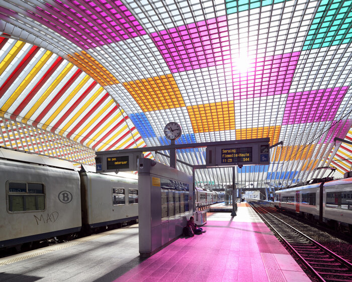 calatrava's belgium railway station is illuminated with artwork by daniel buren