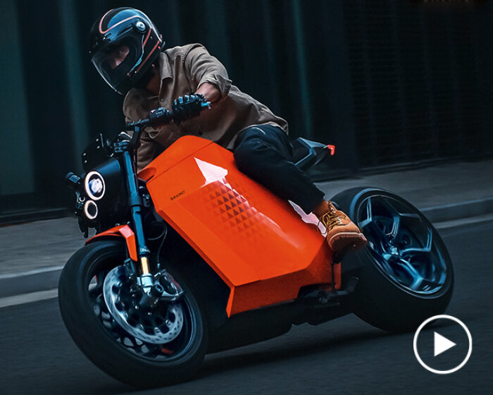 self-balancing davinci DC100 robotic electric motorcycle races to CES 2023