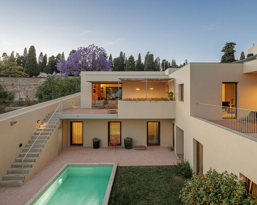 renovated dwelling 'prazeres 37' emerges from a lush garden in lisbon