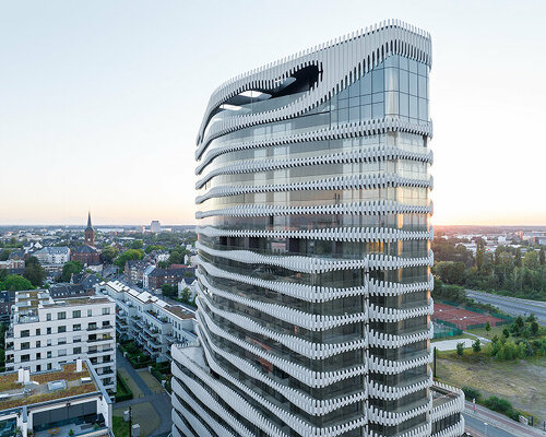 j. mayer h. wraps newly completed düsseldorf tower with a 'zipper' facade