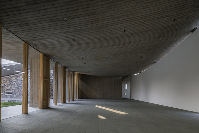 studio zhu pei tops OCT art center with dramatic concrete curves
