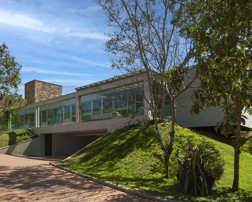 'orchid house' by david guerra doubles as a natural sanctuary in brazil