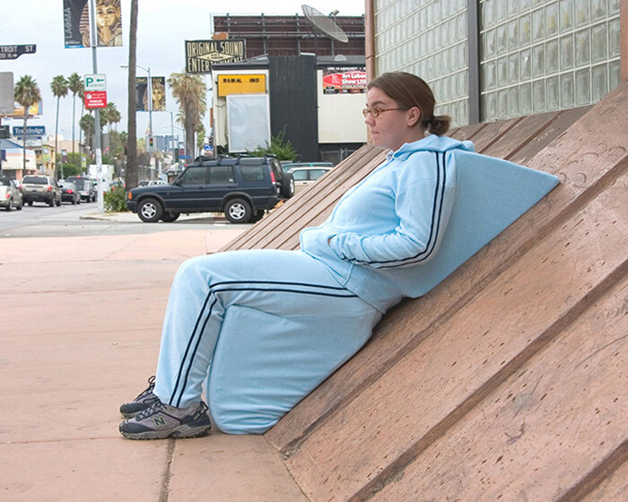 sarah ross defies hostile + inaccessible architecture with satirical jogging outfits