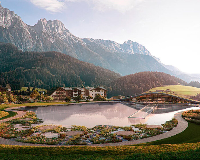 hadi teherani architects form spa under arched terrain in the mountainous alpine scenery