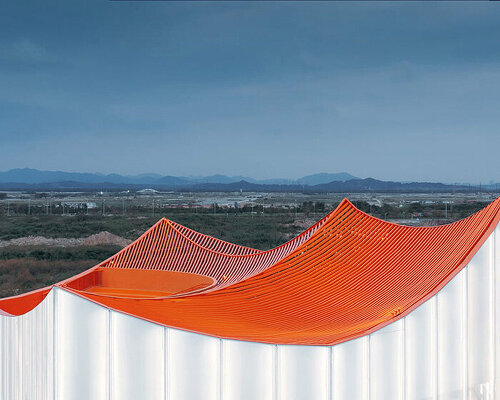 wutopia lab's floating showroom with sweeping orange peaks echoes chinese mountainscape