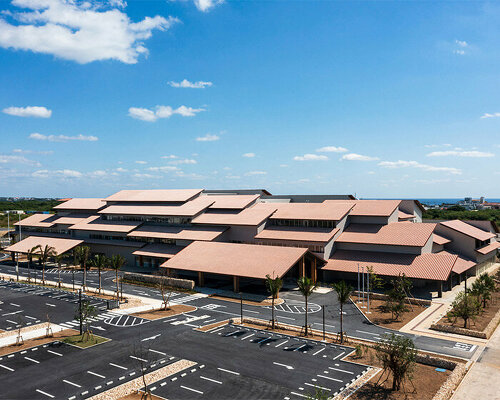 overlapping roofs top kengo kuma's reconstructed city hall in tsunami prone ishigaki island