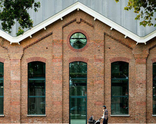 heavy gear workshop renovation exposes massive steel curtain in utrecht