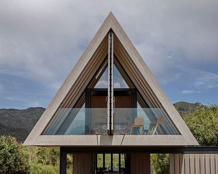 A-frame cabin in new zealand pays respect to local coastal landscape and maori culture