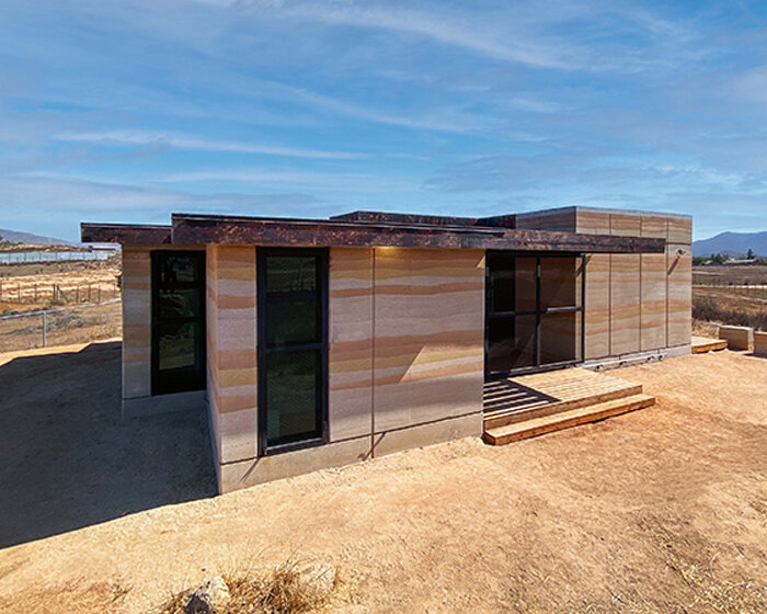 clad in rammed earth + burnt wood, 'santerra house' echoes the arid mexican landscape