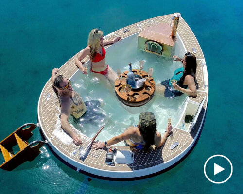 hot tub boat 'spacruzzi' drifts on the sea with gas-powered fireplace stove