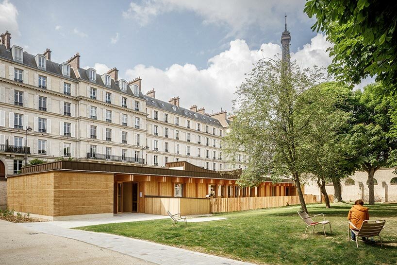 bio materials adorn childcare center within palais de l alma in paris