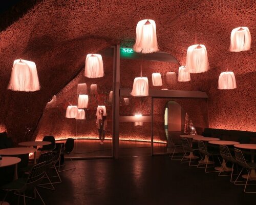 hermès weaves a garden of life-size bamboo caves from recycled brushes in qatar