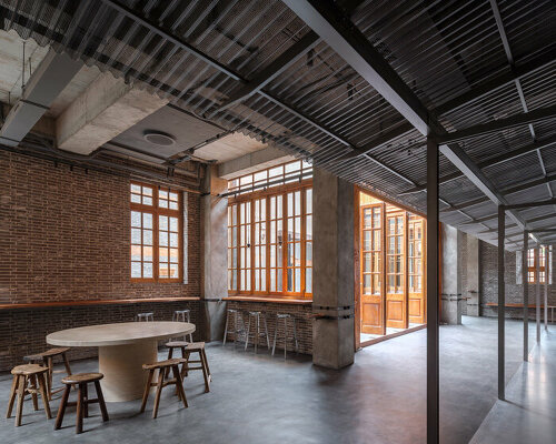 blue bottle coffee shop by neri&hu is a 'primitive shed' within historic shanghai house