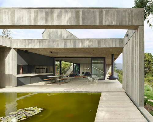 centered around a patio, this house in chile subtly meshes exposed concrete with travertine