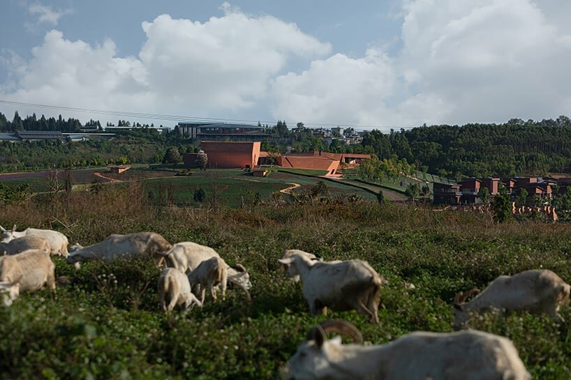 the yunnan art center emerges through the mountainous landscape of Mile City