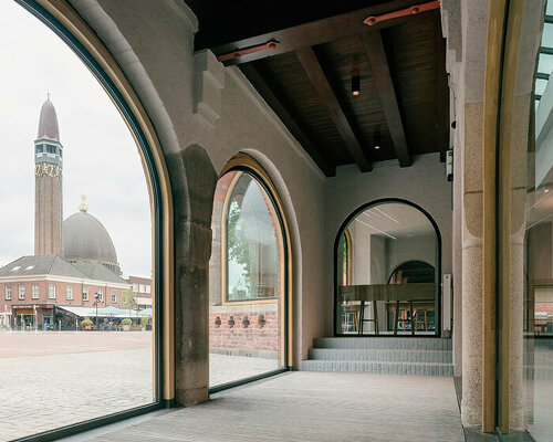 arched brickwork cut-outs by civic architects reveal renovated shoe museum