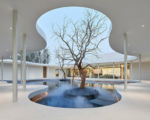 white orchid pavilion in china unravels exhibition booth in curved abstract forms