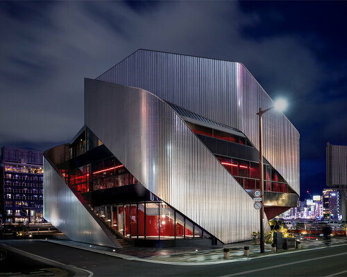 stainless steel 'curtains' gently wrap around japan's new cultural complex