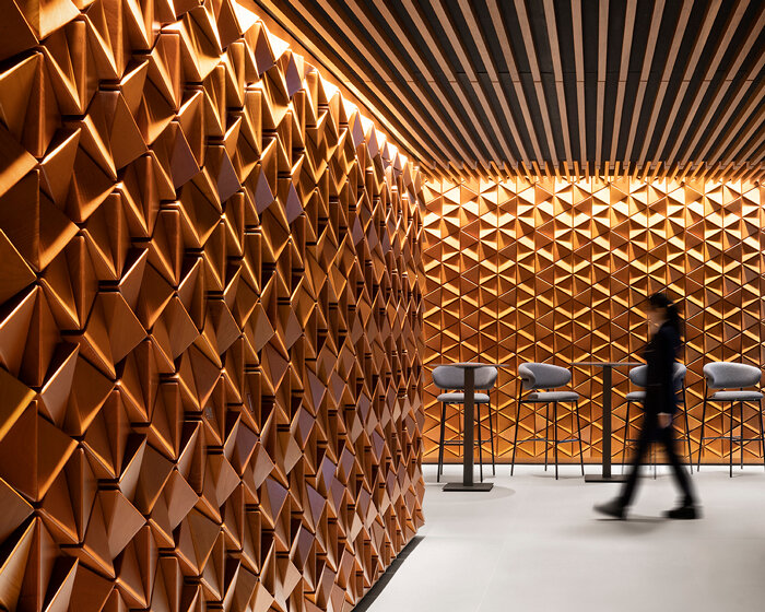 andrea maffei architects clads milan's DAV restaurant interior in pyramid wooden panelling