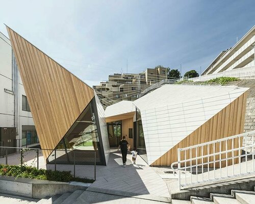 uneven geometry rises dramatically for kengo kuma's daycare center in japan